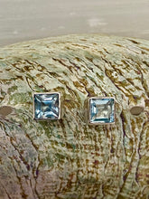 Load image into Gallery viewer, Blue topaz gemstone earrings styled flat lay – Berry Lush Designs jewellery collection