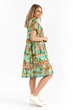 Load image into Gallery viewer, Side view of Colette Dress showing in-seam pockets and frill hem