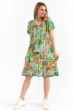 Load image into Gallery viewer, 	Front view of cotton mint dress with tassel ties and button detail