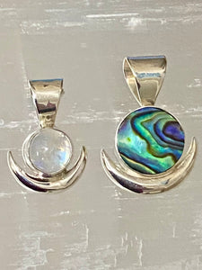 Handcrafted New Moon pendant in sterling silver with iridescent Moonstone gem.